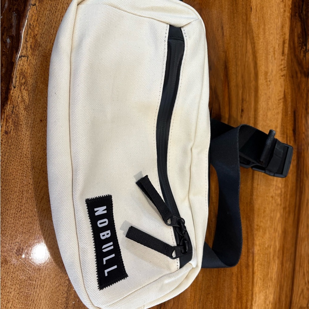 NOBULL Cream and Black Belt Bag Modern Design